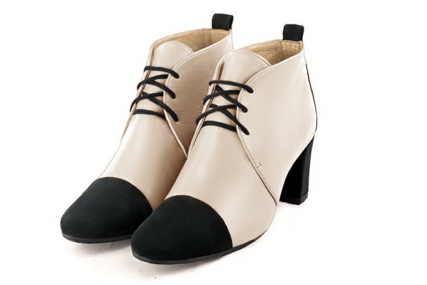 Champagne white and matt black women's ankle boots with laces at the front. Round toe. Medium block heels. Front view - Florence KOOIJMAN